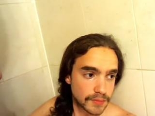 Nice-looking fag is jerking off in the bedroom and shooting himself on webcam