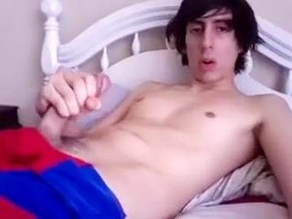 Charming male is masturbating in his room and filming himself on computer webcam
