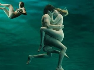 Jim Sturgess and Joe Anderson show butt in a peaceful and beautiful underwater scene.